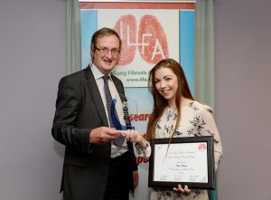 Terence Moran presenting an award to Katie Barry